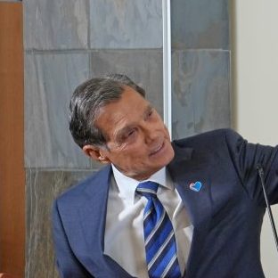 Federico Pena at a portrait unveiling